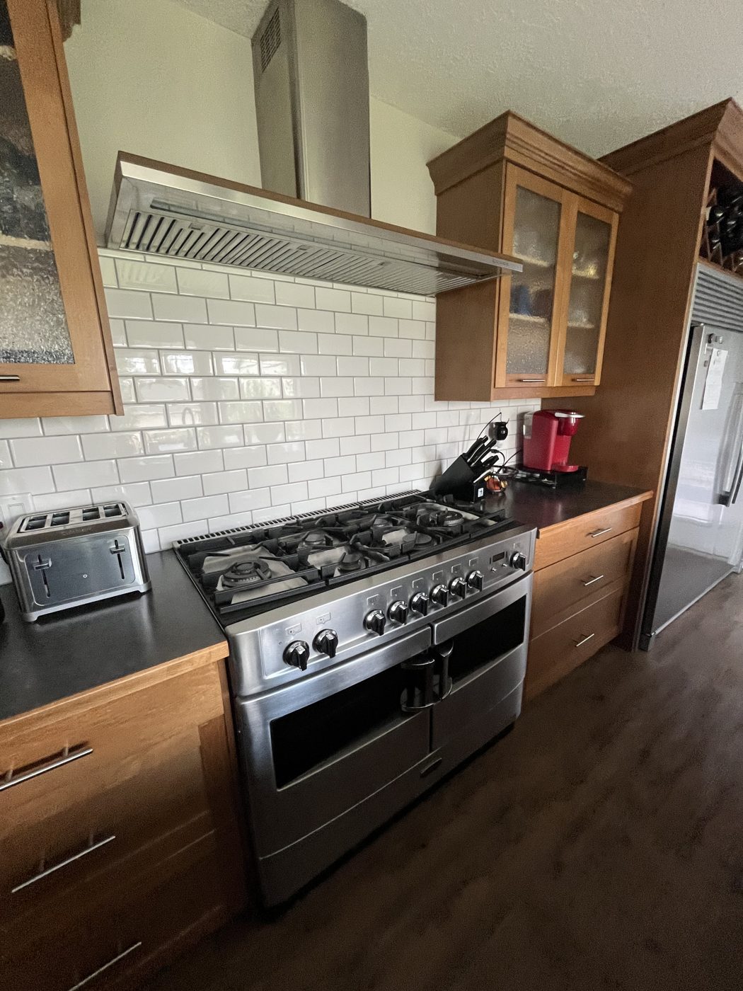 Clean kitchen with gas range